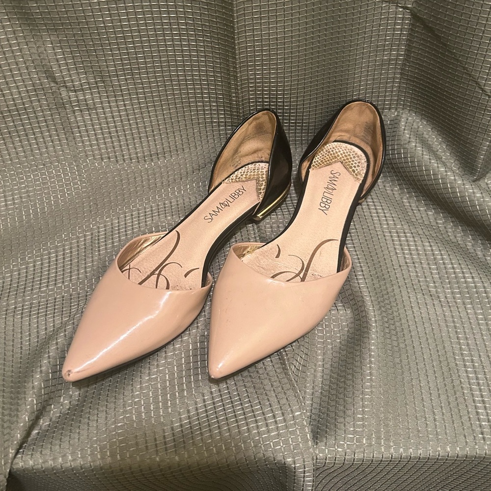 Beige and black pointed toe flats